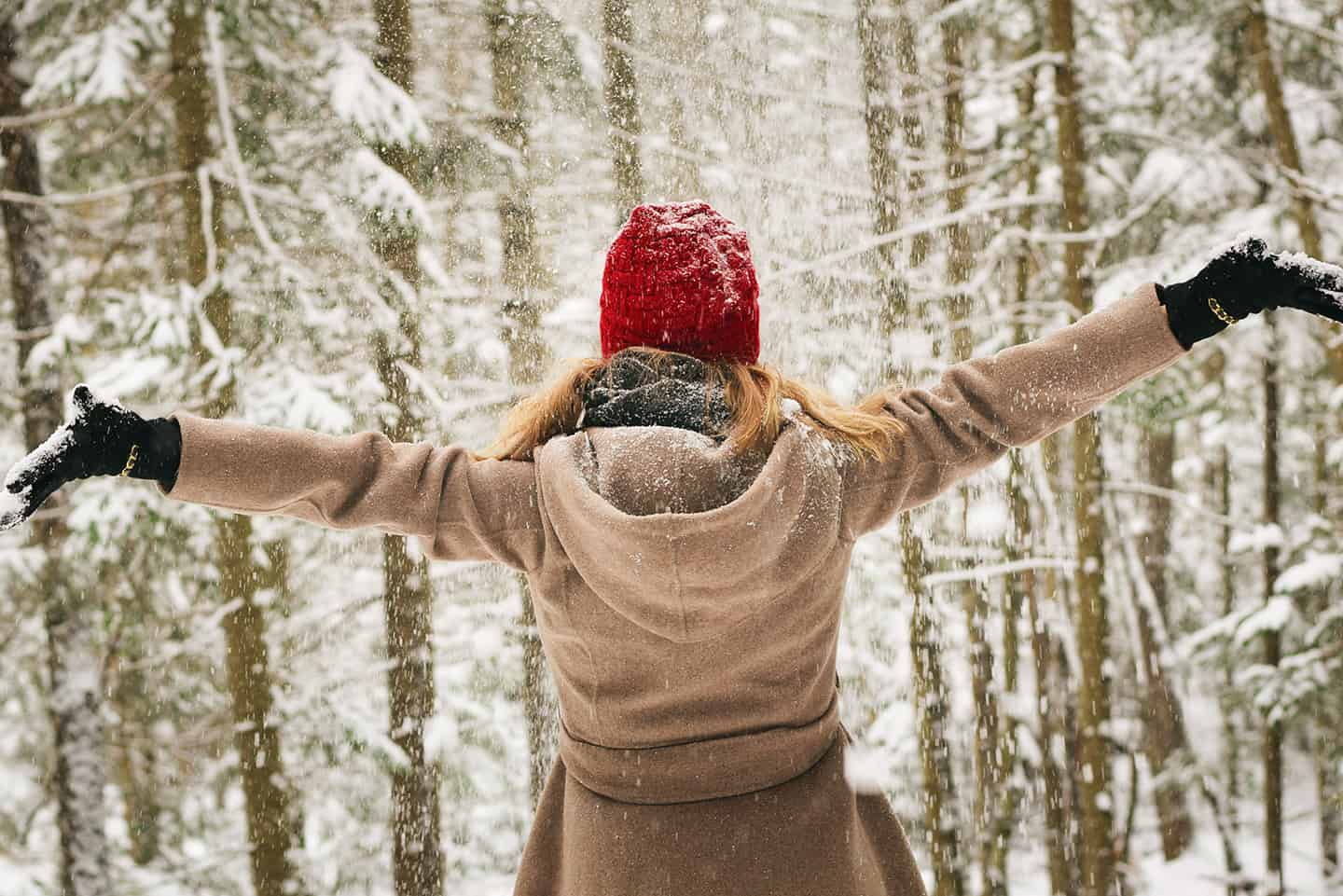 Woman standing in the snow in Colorado