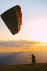 Paragliding into sunset