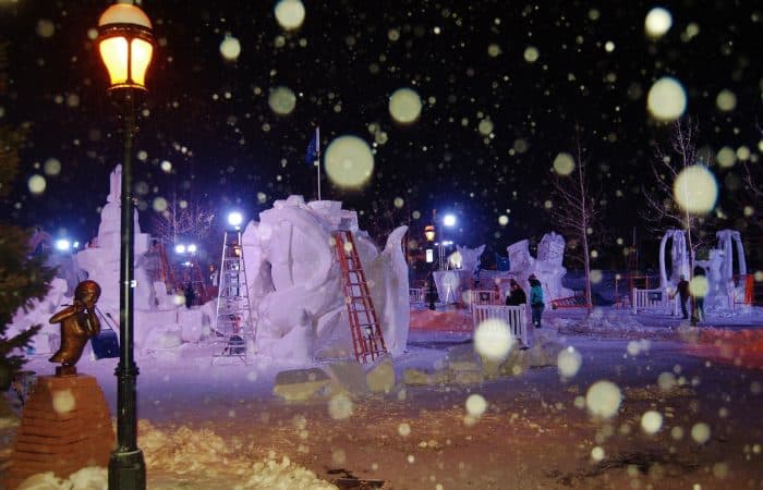The Friday before the close of sculpting, teams work through the night to complete their masterpieces, each constructed from a 12-foot-tall, 20-ton block of Colorado snow.