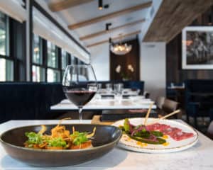 Two plates of food from Vail's Slope Room restaurant