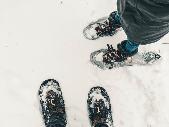 Two people in snowshoes in the snow