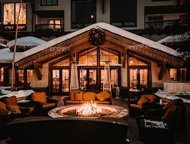 Vail hotel with a fire pit and Christmas lights