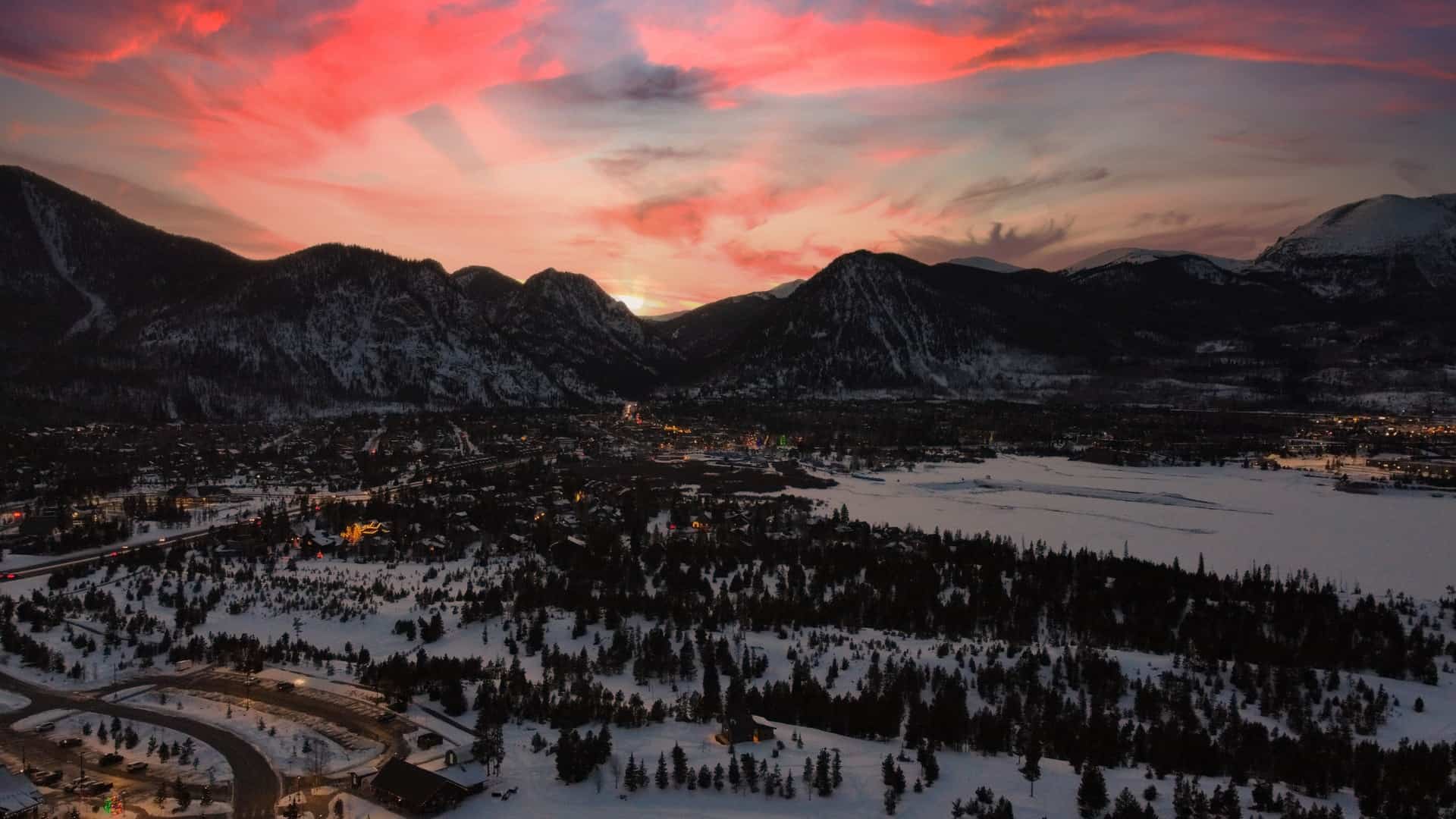 The tow of Frisco at sunset with a frozen lake Dillon