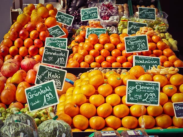 A pile of different fruit at an outdoor market