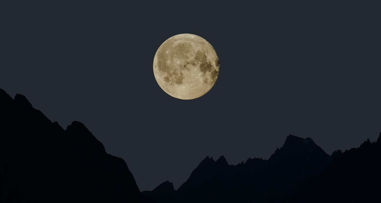full moon with a mountain silouhette