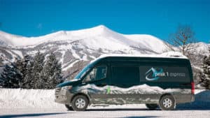 Peak 1 Express Van in front of Breckenridge Mountain