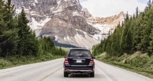 Rental car driving towards a mountain