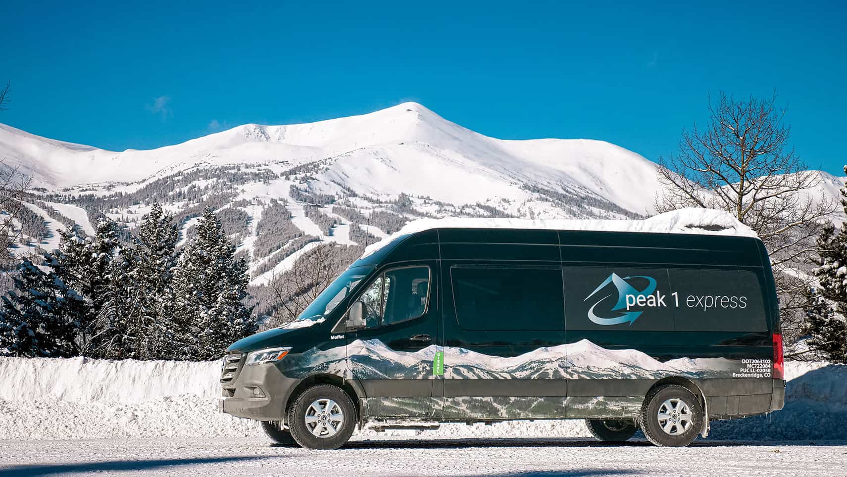 Peak 1 Express van in the Rocky Mountain snow