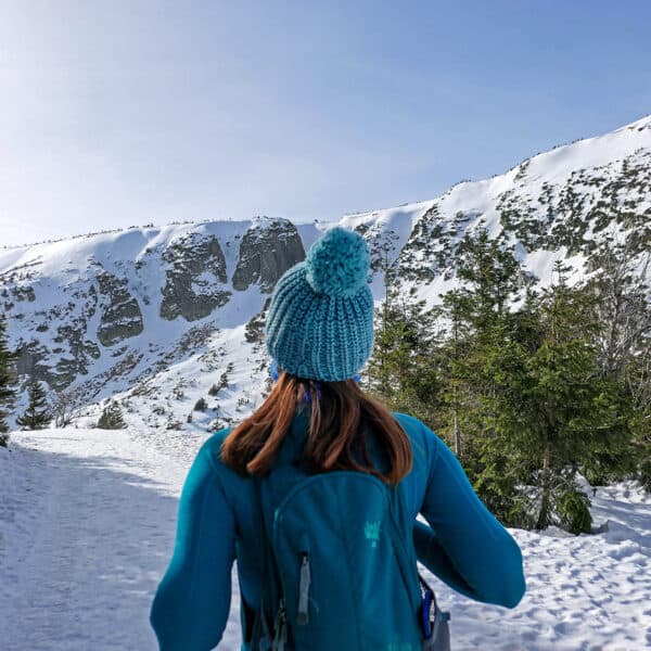 woman in the rocky mountains in the winter