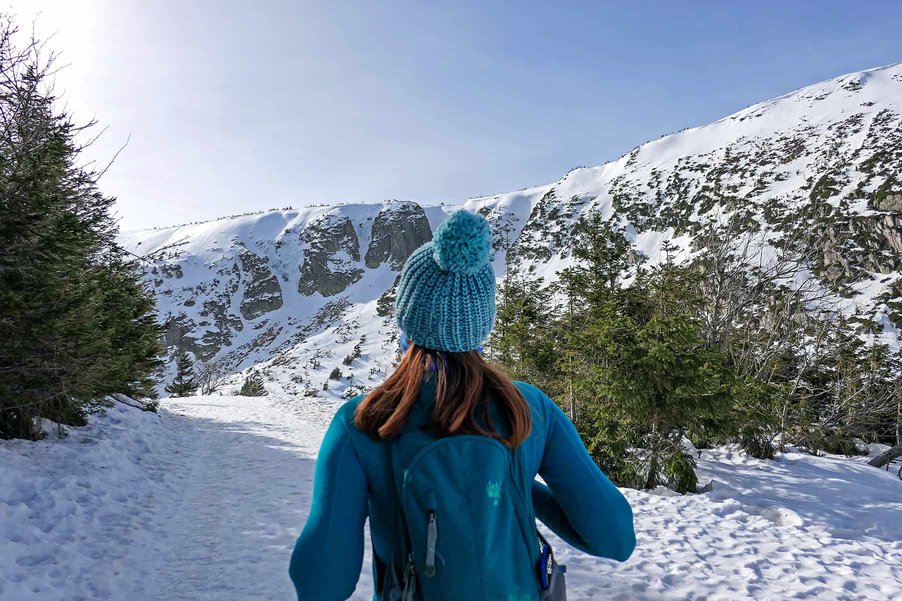 woman in the rocky mountains in the winter