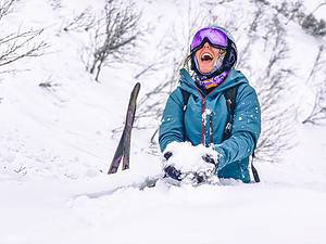 Woman sitting in snow