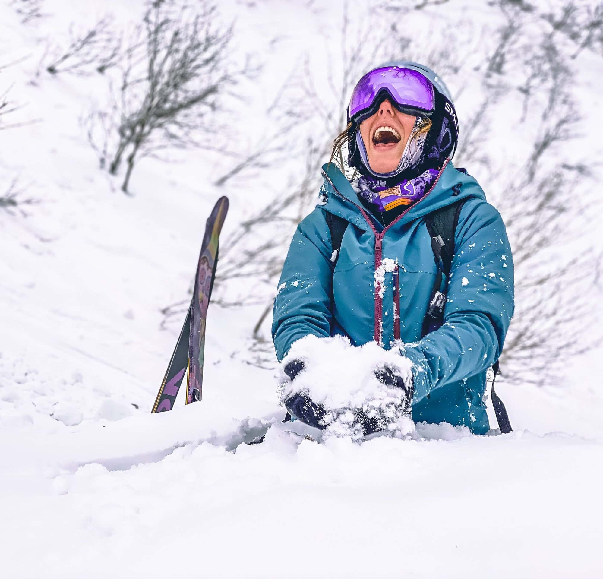 Woman sitting in snow