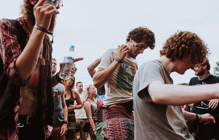 people dancing at outdoor concert