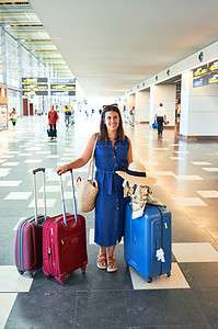 woman holding bags at airport