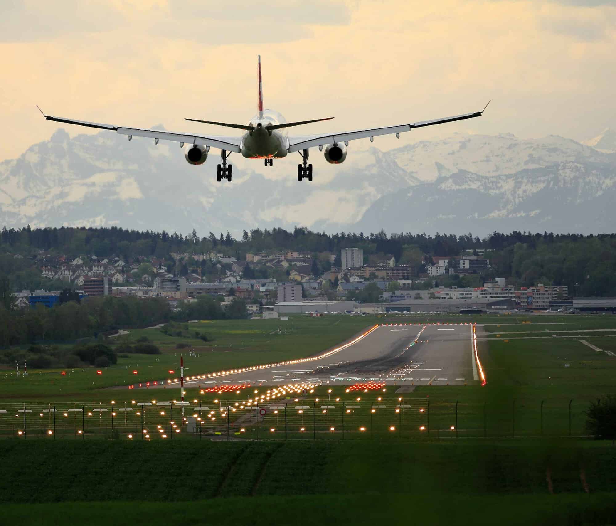 plane flying into distant mountains