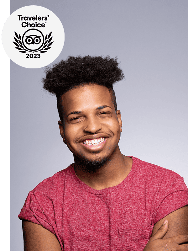 Man smiling with arms crossed