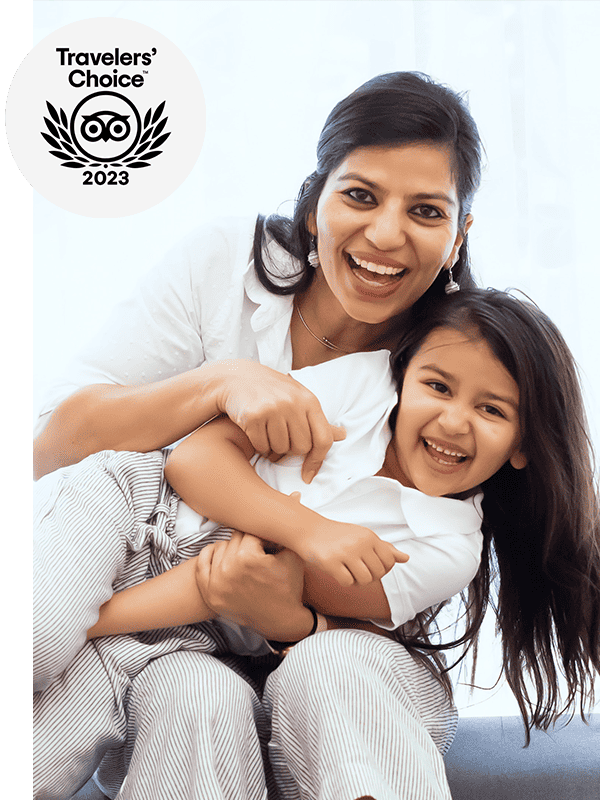 Woman holding a child and smiling