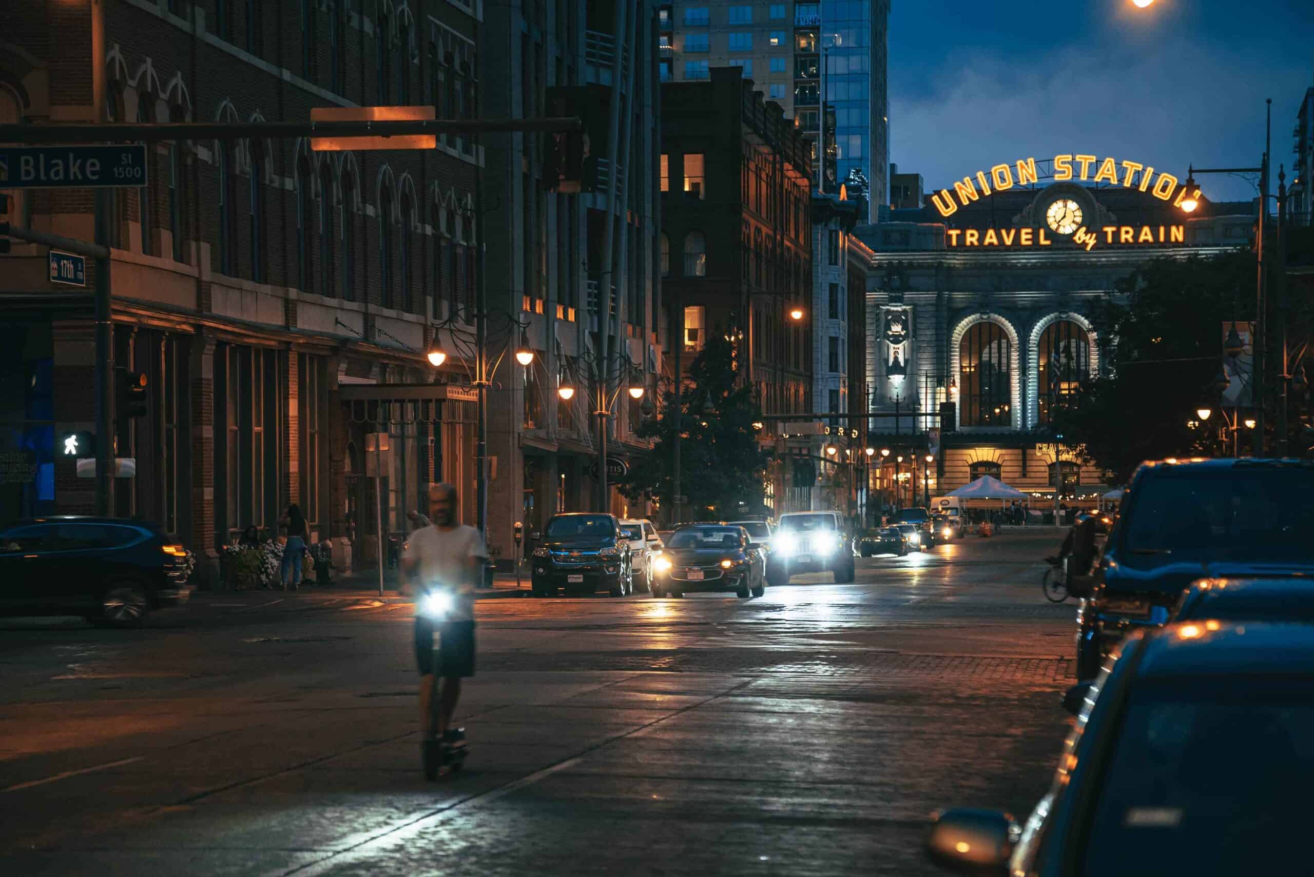 man scootering in front of union station