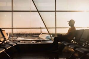 man sitting at airport gate