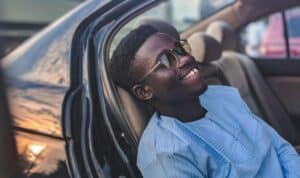 man relaxing in car seat