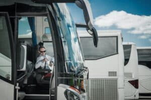 driver posing for camera from inside the shuttle