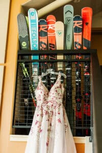 wedding dress in front of skis